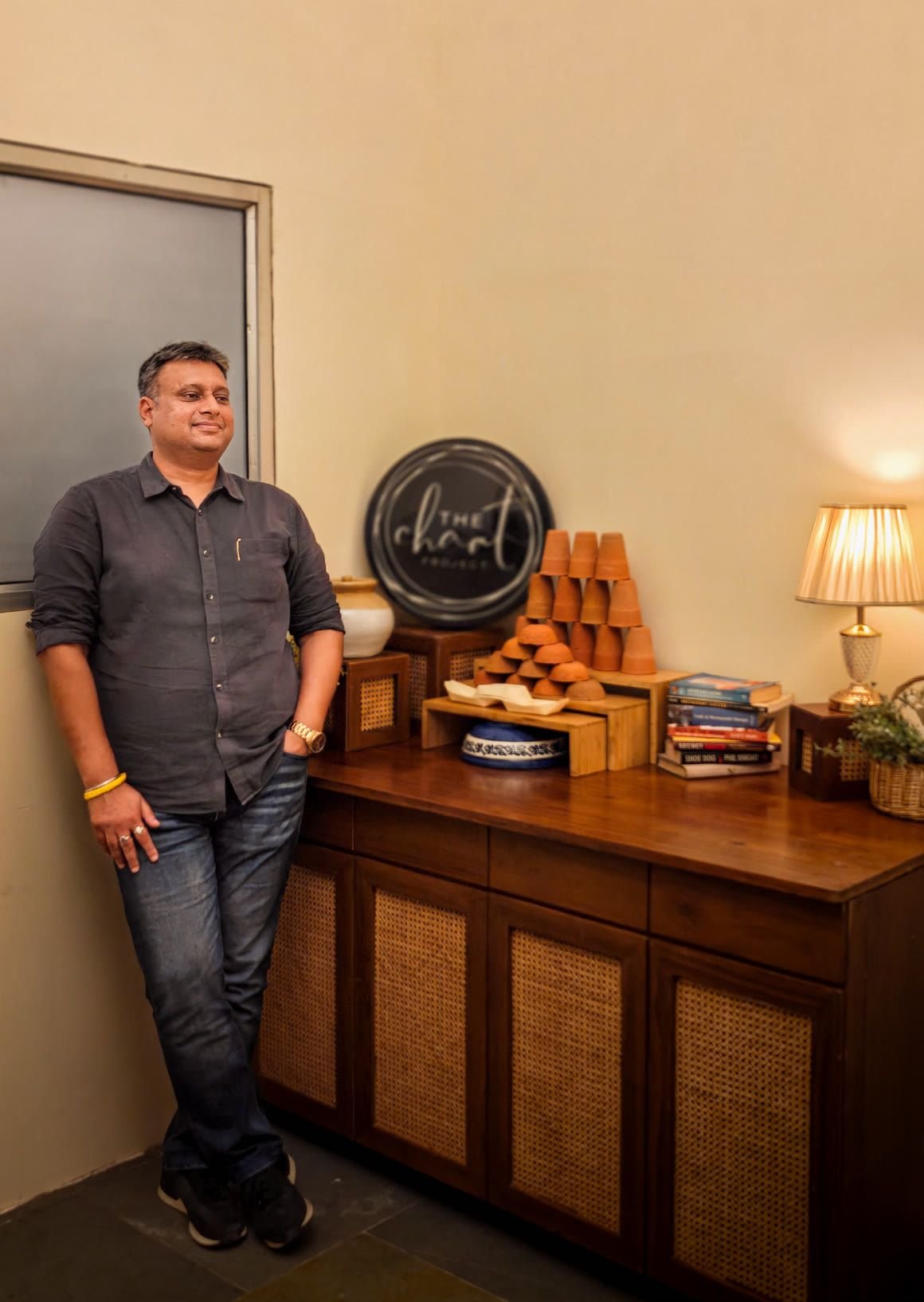Sumit Garg, founder of The Chaat Project live counter catering, beside a stack of terracotta kulhads